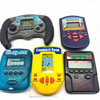 All five handheld electronic games laid out
