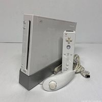 Console on stand with Wii Remote and Nunchuk