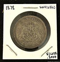 Front side of 1878 Sweden 2 Kronor silver coin showing coat of arms and denomination