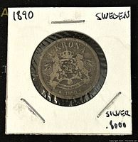 Obverse side of the 1890 Sweden 1 Krona silver coin showing the coat of arms and denomination
