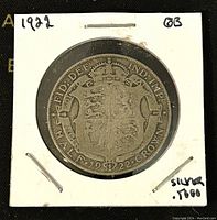 Reverse side showing royal shield, year 1922, and denomination Half Crown.