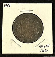 Reverse view showing the Canadian Coat of Arms on the coin with 80% silver content indicated.