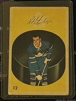 Front of 1962 Parkhurst NHL Edward Litzenberger hockey card showing player image in blue Toronto Maple Leafs uniform, card number 12, yellow background with facsimile signature above.