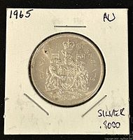 Coin side showing the Canadian coat of arms with inscriptions 'CANADA 50 CENTS 1965' and details of the coat of arms.