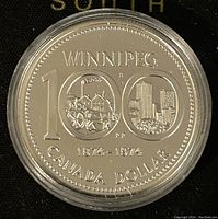Reverse of coin showing Winnipeg 100th anniversary design with dates and inscription.