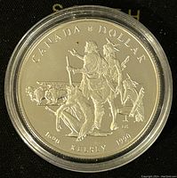 Reverse side showing commemorative design of Henry Kelsey and explorers with inscriptions marking anniversary and value.