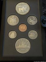 Image showing the front display of the 1985 Canadian silver proof coin set with all coins mounted securely inside the case, highlighting the double dollar coin with a moose.