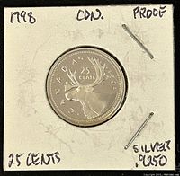 Obverse side showing caribou and coin details including year and silver purity.