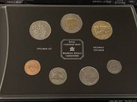 Front view of the 7 Canadian coins displayed in the specimen set case labeled 'Royal Canadian Mint Specimen Set'