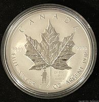 Front side of coin showing detailed maple leaf with D-Day privy mark and purity markings.