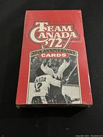 Front view of sealed red box showing Team Canada 1972 20th Anniversary cards with a hockey photo.