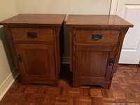 Front view of both oak side cabinets showing drawer and door configuration