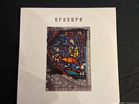 Front cover of Erasure The Innocents vinyl record showing stained glass window artwork and title