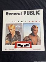 Front cover of General Public vinyl record album All The Rage showing portraits of two band members and album title text.