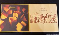 Both Genesis vinyl albums placed side by side showing their covers: the first with geometric shapes and the second with illustrated Victorian figures.