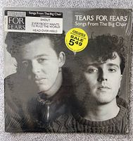 Front cover of the vinyl album Songs From The Big Chair by Tears For Fears showing black and white photo of the band members, album title, highlighted track listing, and original price sticker from Cheapies Warehouse Store.