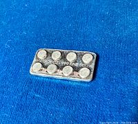 Front view of one 2x4 LEGO inspired silver bullion bar, showing the raised circular studs and inscription "1/4 TROY OZ .999 FINE SILVER" on a blue background.