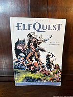 Front cover of The Complete Elfquest Volume 1 showing illustrated elf and wolf characters, author names, and title.