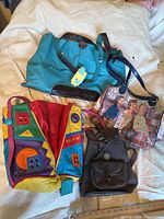 All four vintage purses and bags displayed together showing colorful and diverse styles
