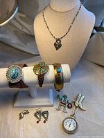 Overview of all jewelry items including necklace, bracelets, earrings and charms