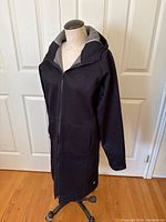 Black Lulu Lemon 3/4 length fleece lined zip-up sweater displayed on a mannequin showing front and collar details.