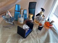 Full group of eleven vintage perfume bottles