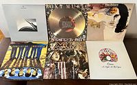 Front of six vinyl LPs including Various Artists, Roxy Music, The Doors, Split Enz, MC5, Queen.