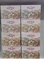 Photo showing 8 boxed David Winter miniature cottages stacked in two columns.