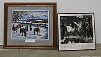 Two framed art prints side by side on a white background. Left: colored Don Stivers print with horses and people in snow, wooden frame. Right: black and white Ansel Adams Yosemite poster in black frame.