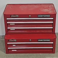 Front view of closed red toolbox showing five drawers and Craftsman logo