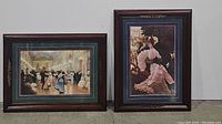 Both framed prints featuring ballroom dance scene and "L'Amitieus" placed side by side on floor.