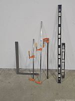 Framing squares, clamps and levels from a distance showing all items in the lot