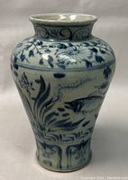 Front view of the Asian hand painted porcelain vase showing floral and fish design and flared rim