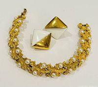 Bracelet and earrings shown together, highlighting gold-tone metal, faux pearls, and clip-on backs.