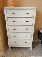 Front view of highboy dresser showing all five drawers and handles