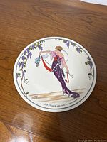 Top view of the entire plate showing fashion design and grapevine border