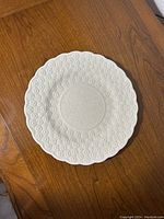 Top view of the Copeland Spode vintage embossed daisy chop plate showing full embossed floral pattern and scalloped edges.