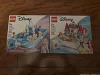 Front of two sealed LEGO Disney sets showing Elsa and the Nokk with 125 pieces, and Ariel, Belle, Cinderella and Tiana with 130 pieces.