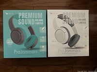 Front packaging showing turquoise and white Helix Pro Jammers headphones with 'Premium Sound Volume Limited' text