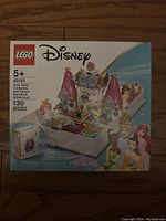 Front of the LEGO Disney Princess Storybook Adventures box showing set number 43193, recommended ages 5+, featuring Ariel, Belle, Cinderella, and Tiana with 130 pieces, and artwork of the storybook castle and boat scene.