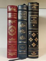 Spines of three Franklin Library books showcasing titles and gilt decoration