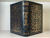Front and back cover with elaborate gold gilt design and spine lettering on dark blue leather.