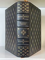 Front and spine view of the black leather bound book with gold detailing showing the title Andersonville by MacKinlay Kantor and The Franklin Library imprint