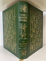 Front view of green leather cover with gilt bamboo design and gilt title text on spine, showing excellent condition.