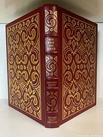 Book cover showing full leather binding with gilt decorative elements and title on spine and cover.