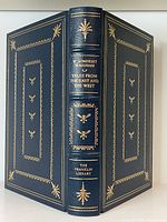 Front and back cover of the book showing full leather binding with gilt decorative embossing and lettering.