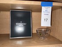 Waterford Crystal vanity dish along with its original box placed on a wooden shelf.