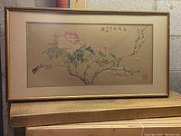 Full view of framed watercolor floral Asian artwork with artist signature and stamps visible.