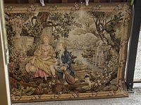 Full view of the vintage wall tapestry showing the romantic garden scene with two figures and surrounding nature.