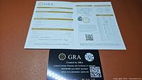 GRA certificate of authenticity with warranty and registration information for moissanite gemstone.